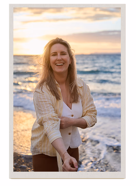 Aline Gerber laughing on the beach at sunset, Amalfi Coast 2026
